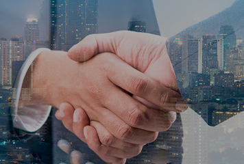 Businessmen handshake in city backgroung banner image